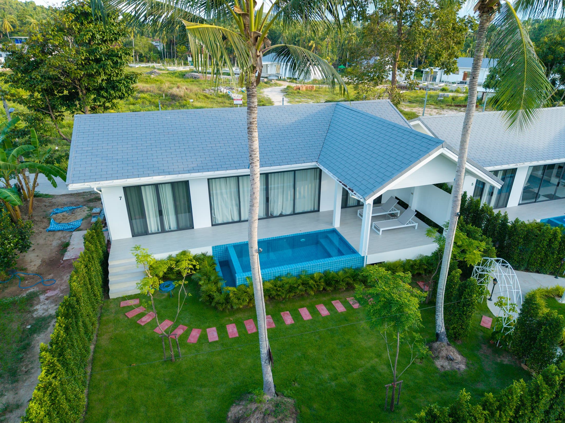 Aerial view of Osho villas among tropical green