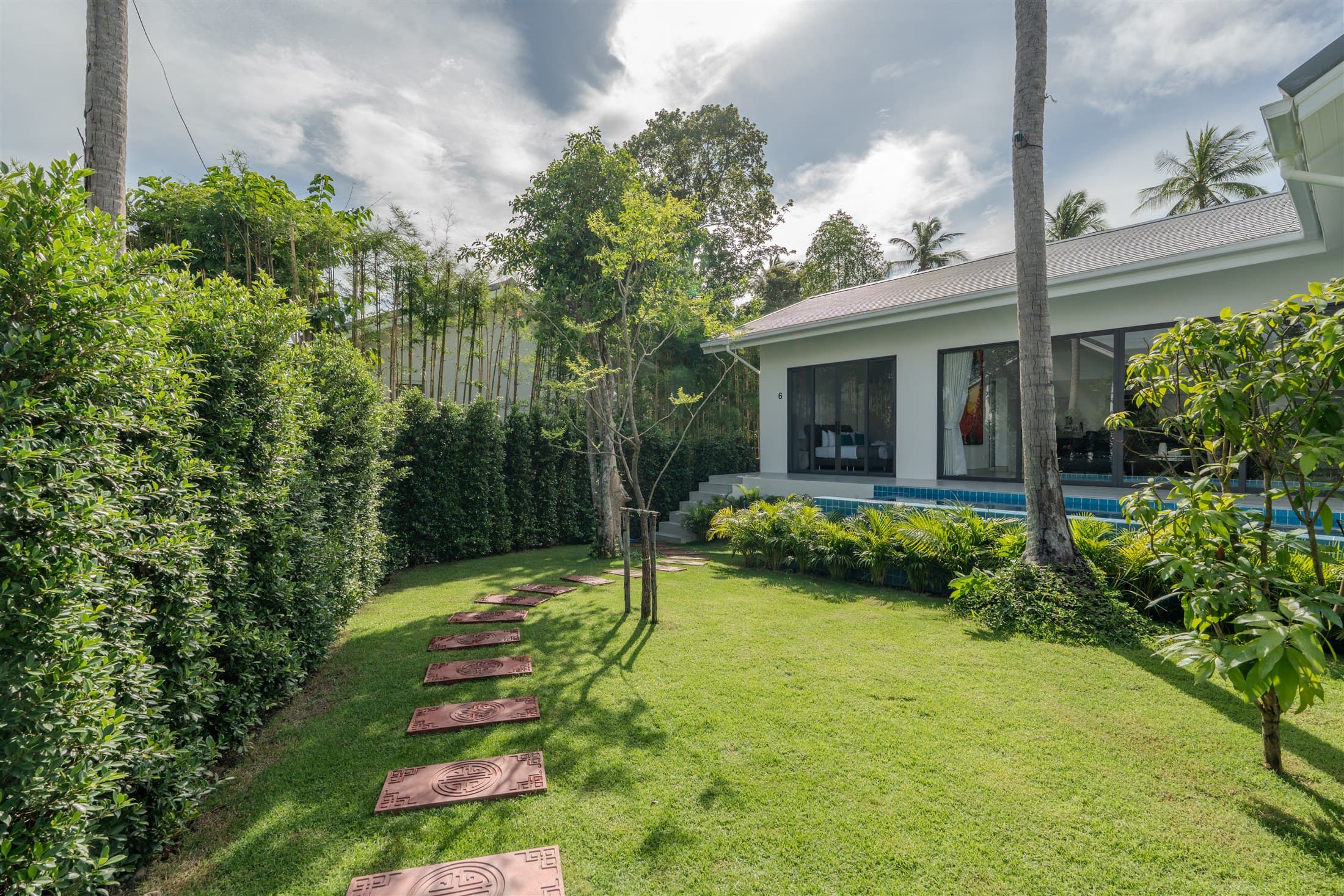 Garden path leading toward an Osho villa